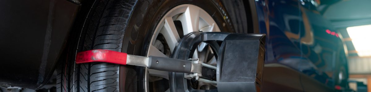 A car undergoing a professional laser wheel alignment check at our Swindon garage.